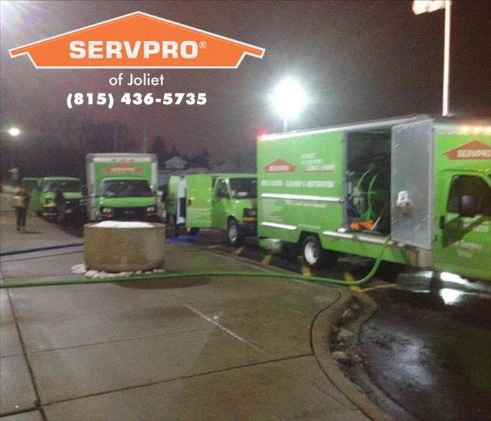 SERVPRO vehicles parked outside a business.